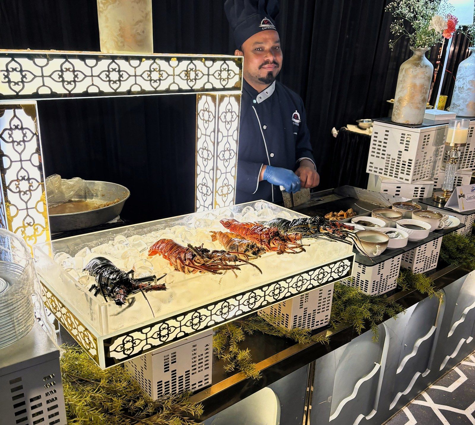 Lobster on ice at a lit jali counter
